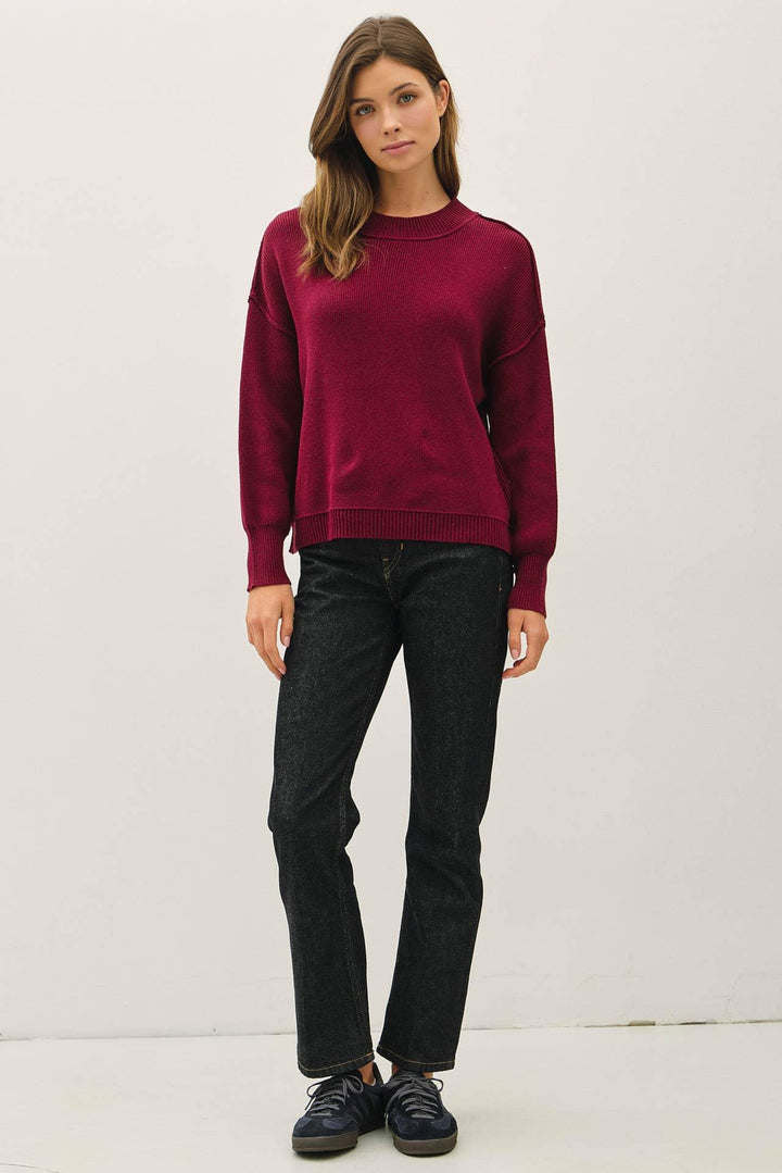 RIBBED KNIT SWEATER WITH RAW SEAM DETAILS