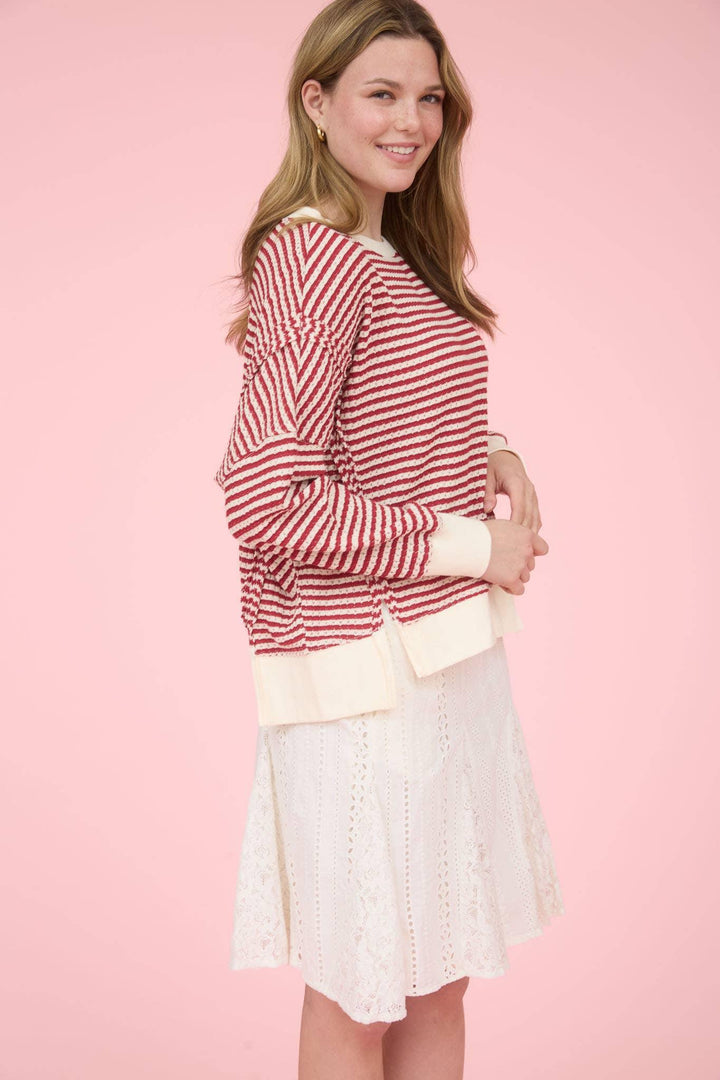 STRIPE EXPOSED SEAM SPLIT HEM LONG SLEEVE KNIT TOP