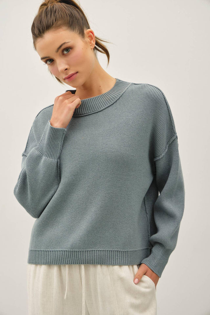 RIBBED KNIT SWEATER WITH RAW SEAM DETAILS