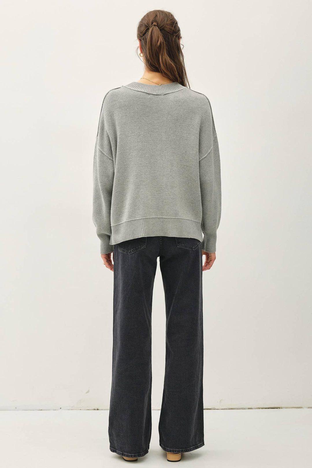 RIBBED KNIT SWEATER WITH RAW SEAM DETAILS