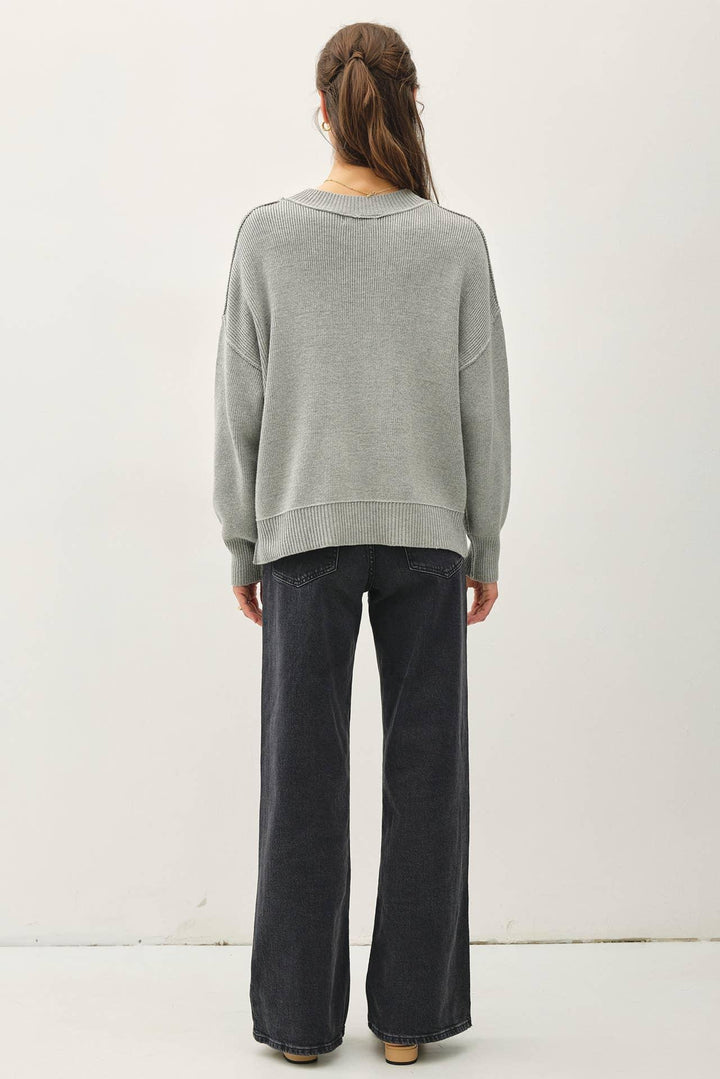 RIBBED KNIT SWEATER WITH RAW SEAM DETAILS