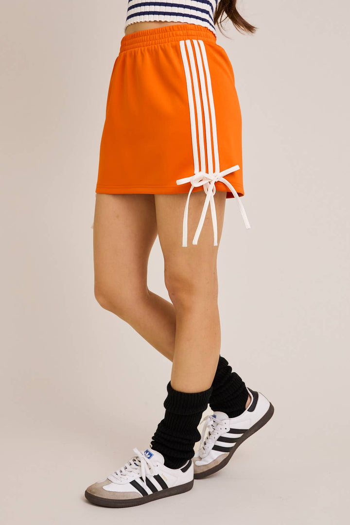 ORANGE BOW DETAIL TRACK MINI SKIRT