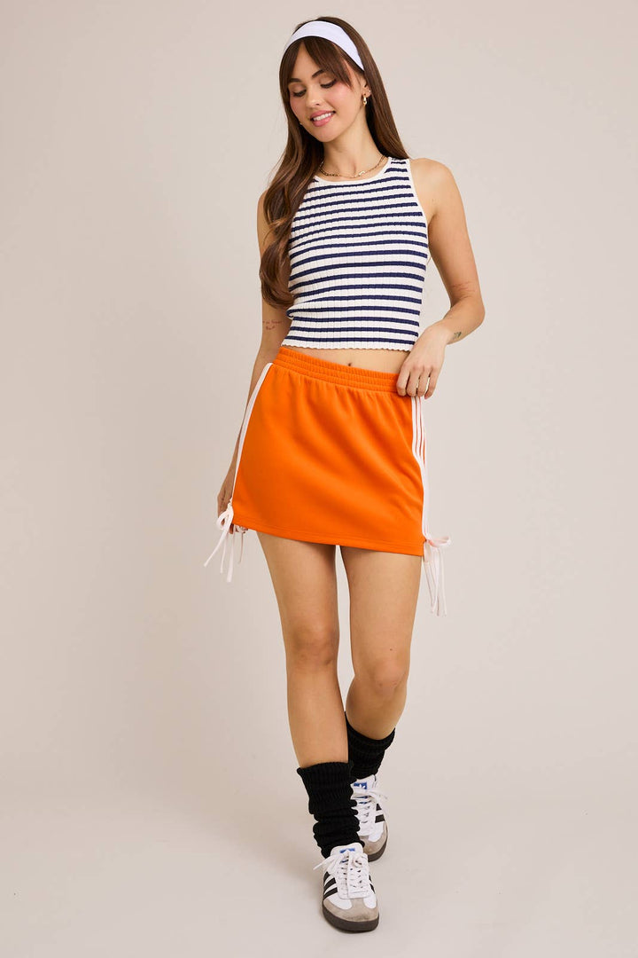 ORANGE BOW DETAIL TRACK MINI SKIRT