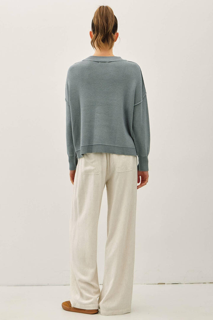 RIBBED KNIT SWEATER WITH RAW SEAM DETAILS