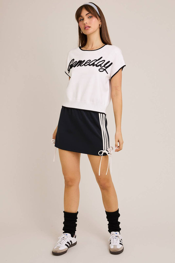 ORANGE BOW DETAIL TRACK MINI SKIRT
