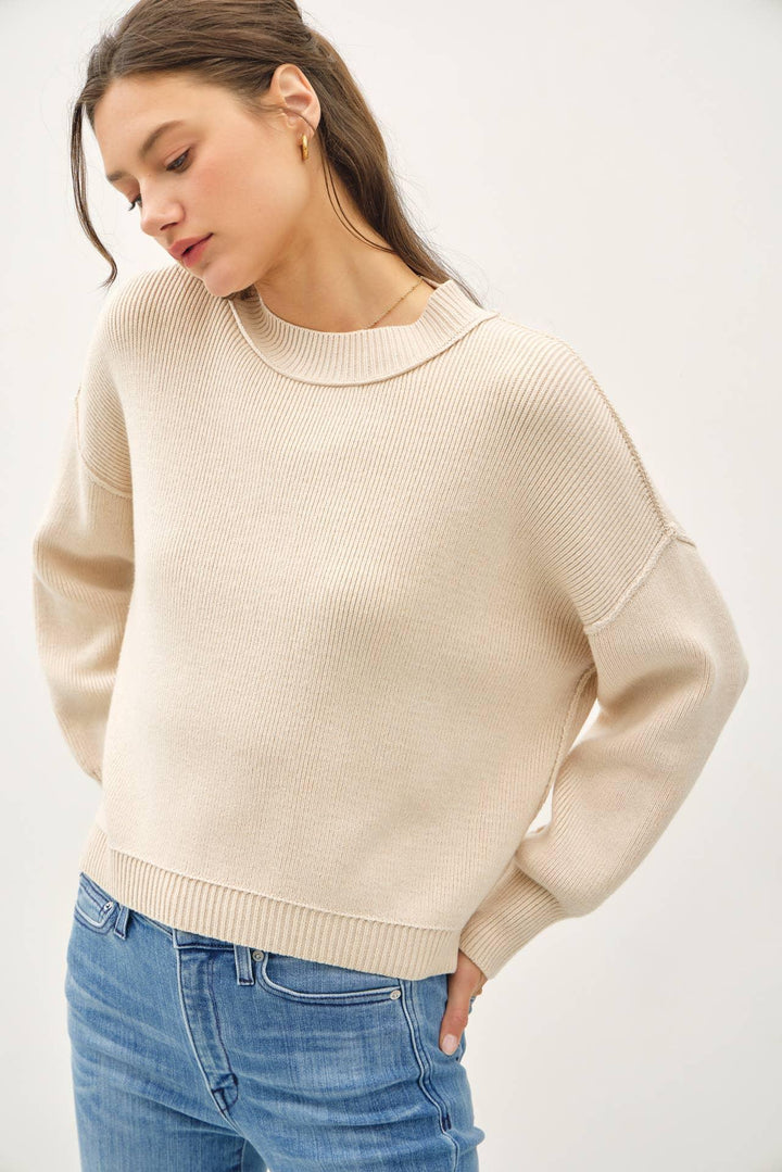 RIBBED KNIT SWEATER WITH RAW SEAM DETAILS