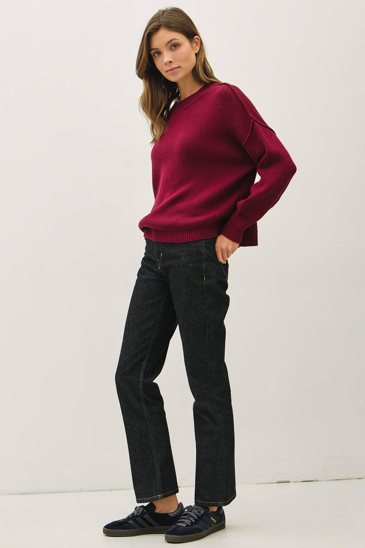 RIBBED KNIT SWEATER WITH RAW SEAM DETAILS