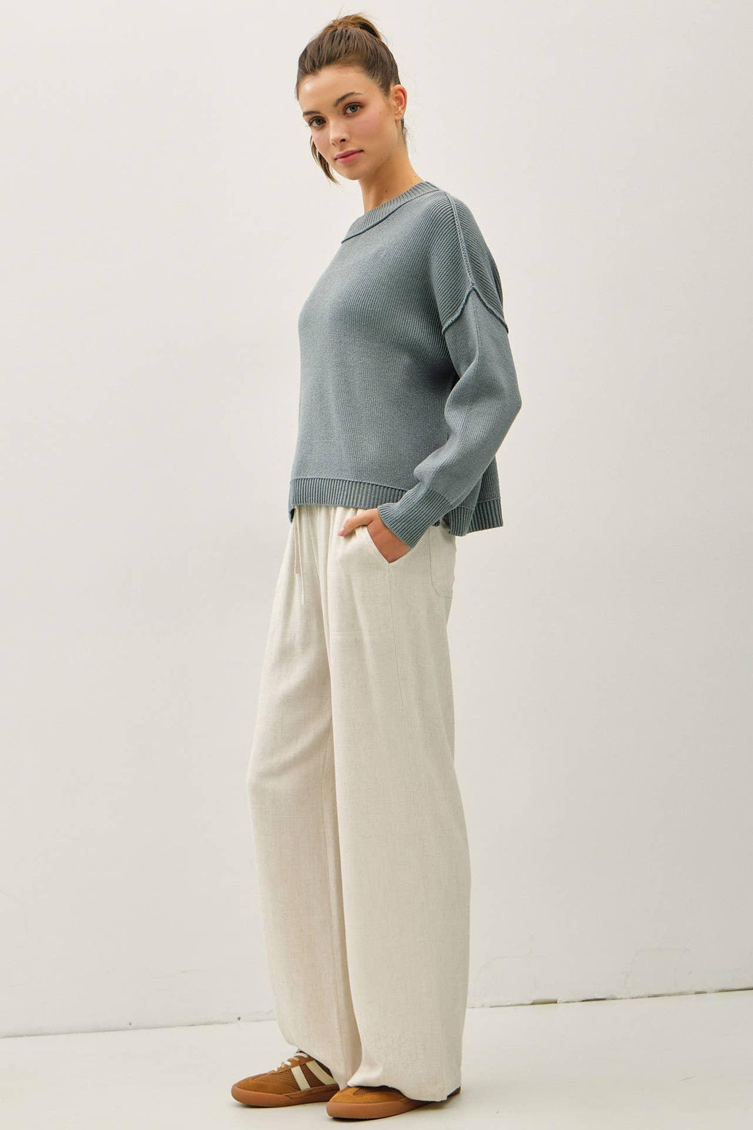 RIBBED KNIT SWEATER WITH RAW SEAM DETAILS