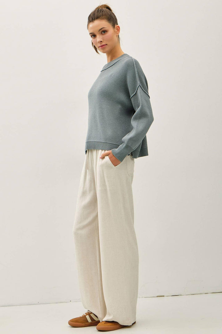RIBBED KNIT SWEATER WITH RAW SEAM DETAILS