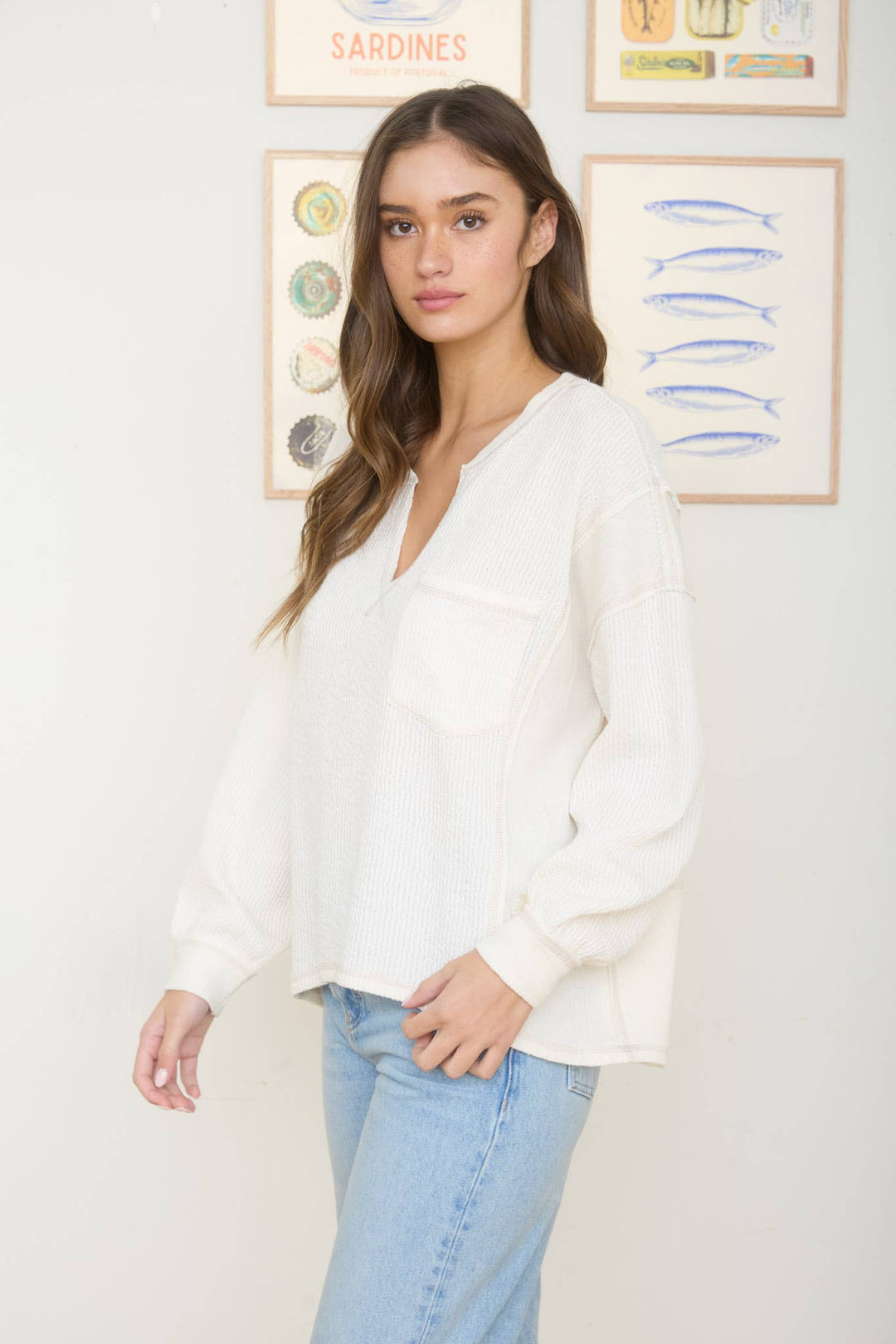 SPLIT NECK RAW EDGE LONG SLEEVE RIBBED KNIT TOP