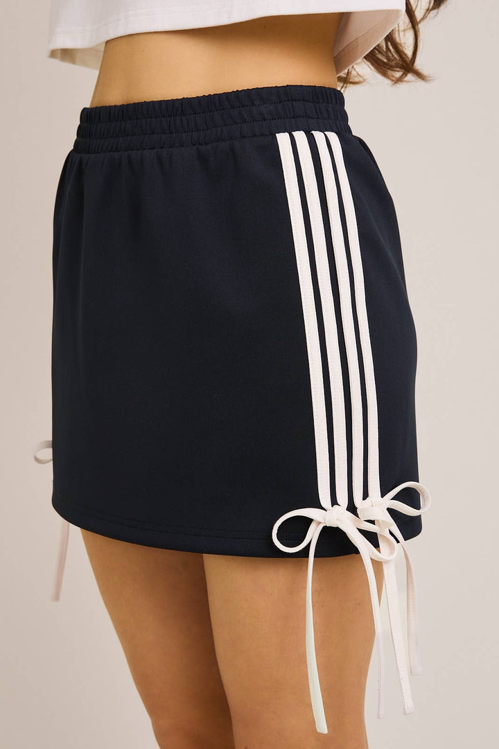 ORANGE BOW DETAIL TRACK MINI SKIRT