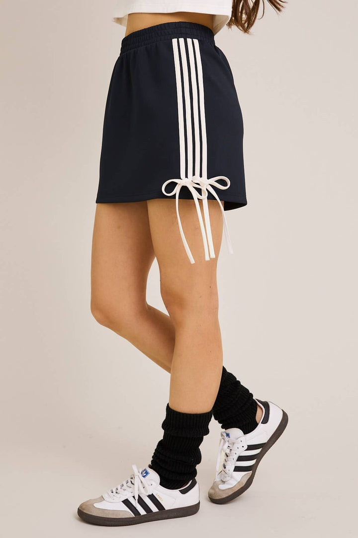 ORANGE BOW DETAIL TRACK MINI SKIRT