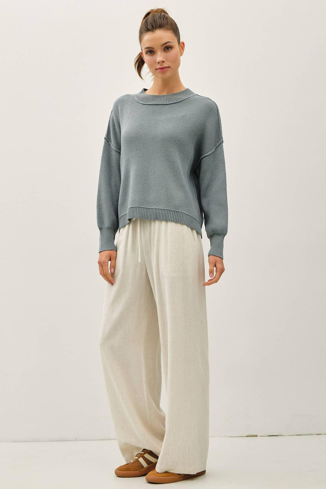 RIBBED KNIT SWEATER WITH RAW SEAM DETAILS